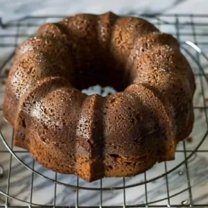 Cooling Chocolate Peppermint Bundt Cake Chocolate bundt cake cooling on a wire rack after being removed from the pan