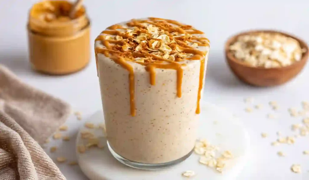 Breakfast Smoothie in Glass with Peanut Butter Drizzle