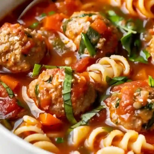 Meatball Soup for a Cozy Weeknight (Family Dinner Friendly) 3 Close-up bowl of meatball soup with rotini pasta in tomato broth
