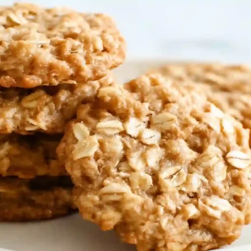 Oatmeal Toddler Cookies for Cozy, Nourishing Snack Moments 3 Soft oatmeal toddler cookies stacked on a plate, close-up view