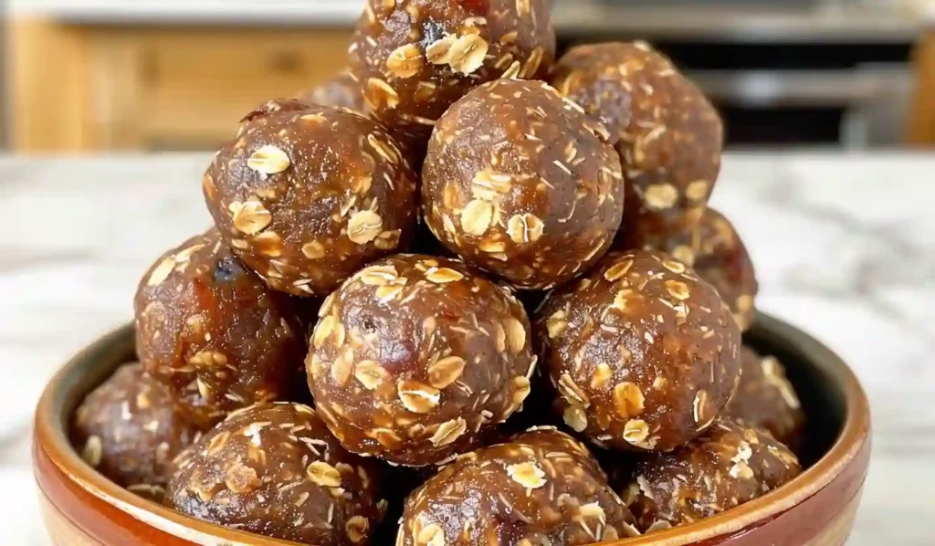 Close-up of homemade energy balls made with Medjool dates and oats in a rustic bowl