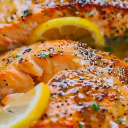 Lemon Garlic Butter Salmon – A Cozy, Nourishing Weeknight Dinner 3 Close-up of lemon garlic butter salmon with cracked pepper and parsley in glossy butter sauce