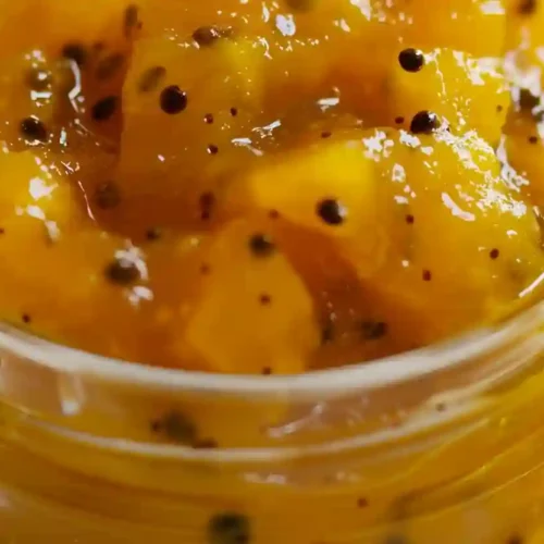 Mango Chutney Recipe – Sweet, Tangy Homemade Comfort for Cozy Cooking 3 Close-up homemade mango chutney in a glass jar with glossy mango chunks