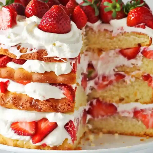 Strawberry Shortcake Recipe – A Cozy Homemade Dessert for Sweet Family Moments 3 Close-up of layered strawberry shortcake with whipped cream and fresh strawberries