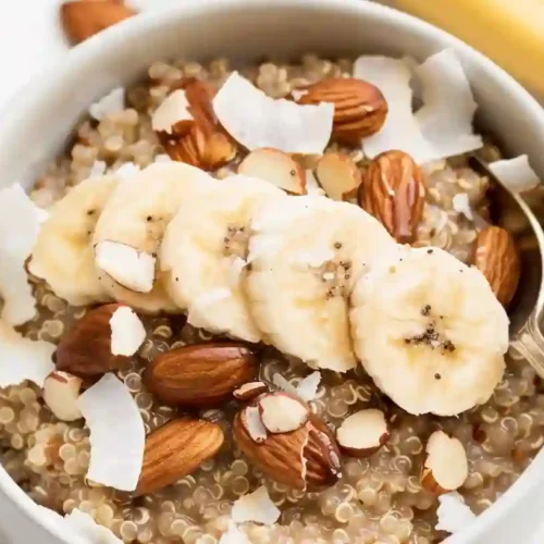 Cozy Quinoa Breakfast Bowls for a Nourishing Start 3 Close-up quinoa breakfast bowl with banana slices, almonds, and coconut flakes