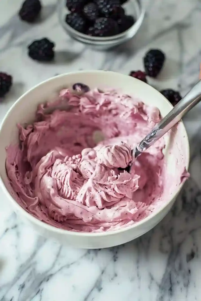 Thick airy blackberry batter gently folded for vegan tiramisu ladyfingers