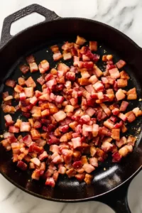 Skillet Chicken With Tomatoes, Pancetta and Mozzarella 11 Diced pancetta sizzling in olive oil inside a cast-iron skillet until golden and crisp.